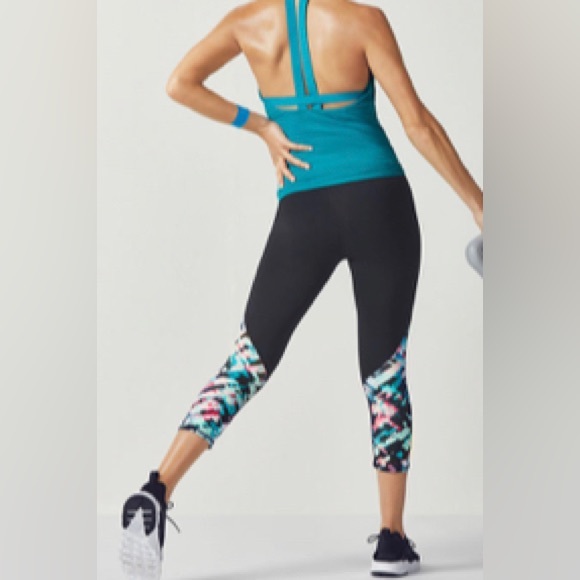 Fabletics capri leggings in black with geometric print design. - Picture 2 of 6